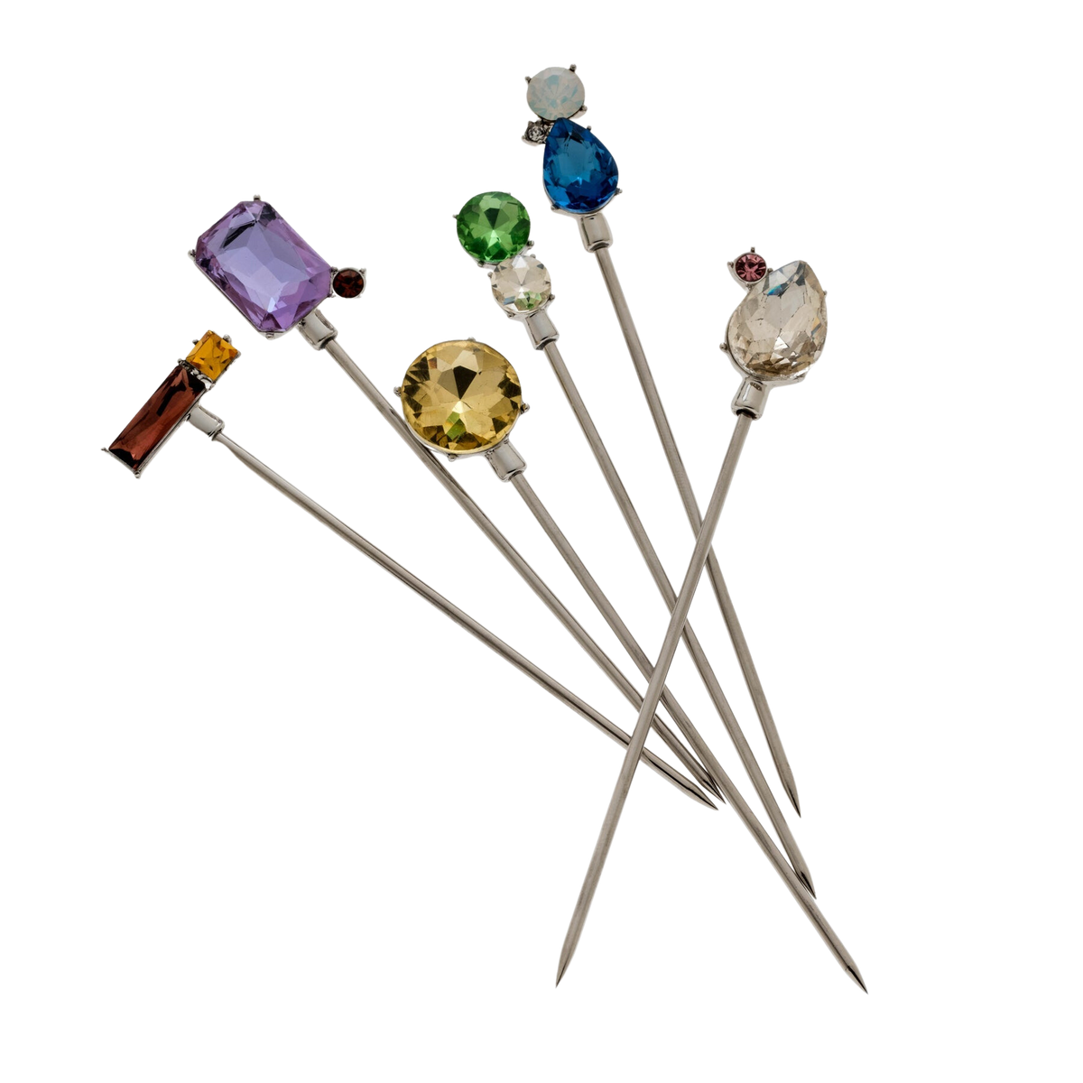 Close-up of six Jeweled Cocktail Picks showcasing multicolored faceted glass jewels with a black background