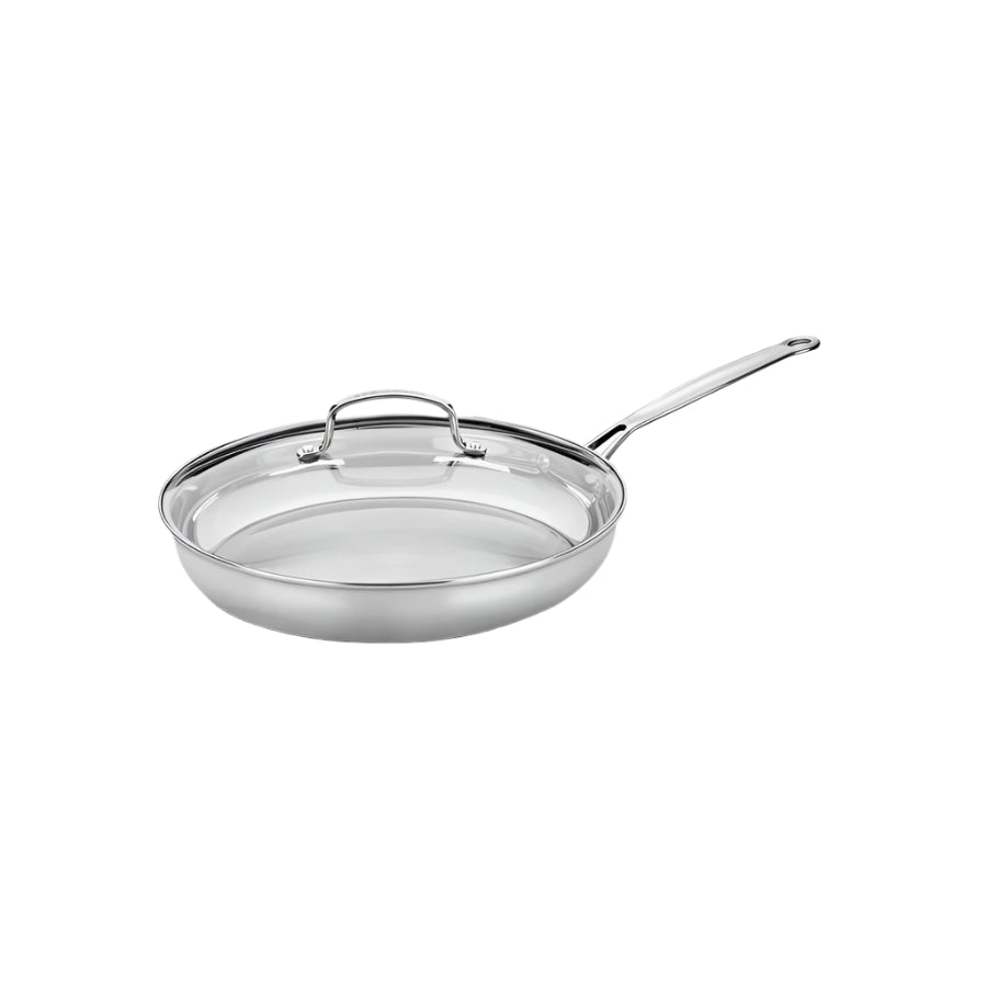 Angled view of Chef’s Classic 12-inch skillet with cover showcasing brushed stainless steel and long handle on white background