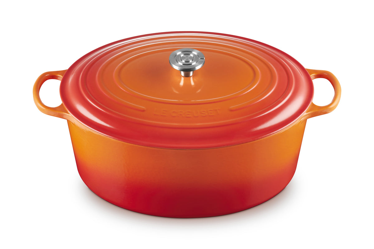 Front view of Signature Oval Dutch Oven in Flame 15.5 qt. with stainless steel knob