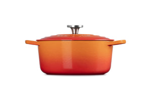 Side view of Signature Round Dutch Oven in Flame with stainless steel knob