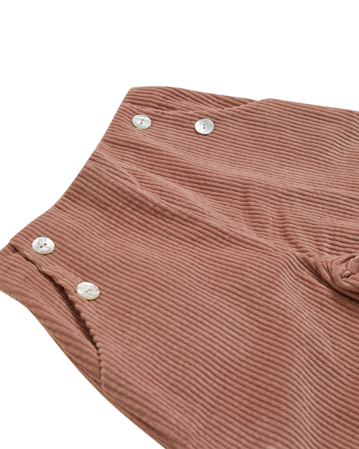 Brown ribbed fabric with silver buttons on a white background