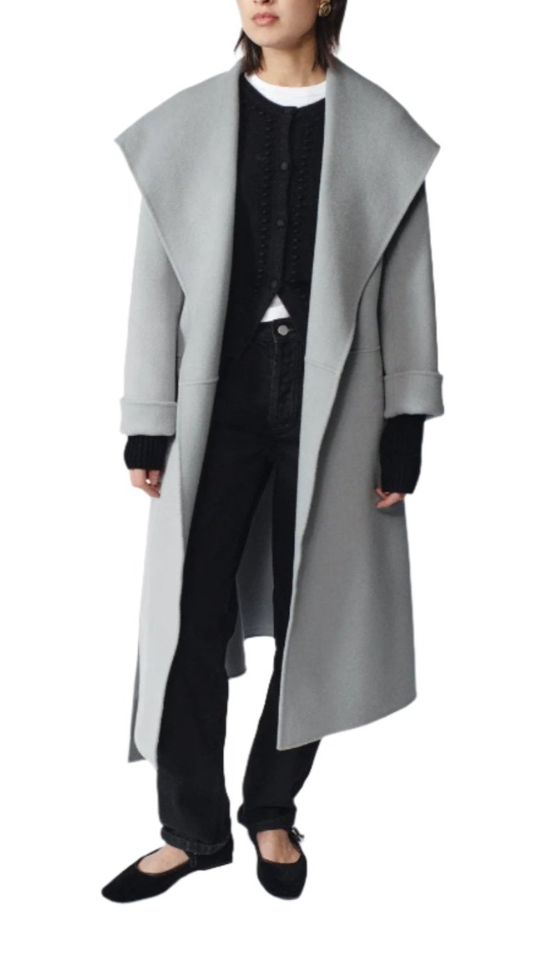 Front view of Gabriella cashmere coat in mint showcasing its longline fit on a model against a white background