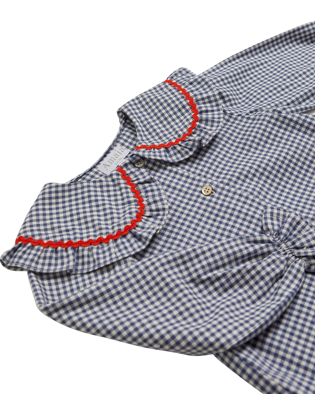 Blue and white checkered shirt with red trim on a white background