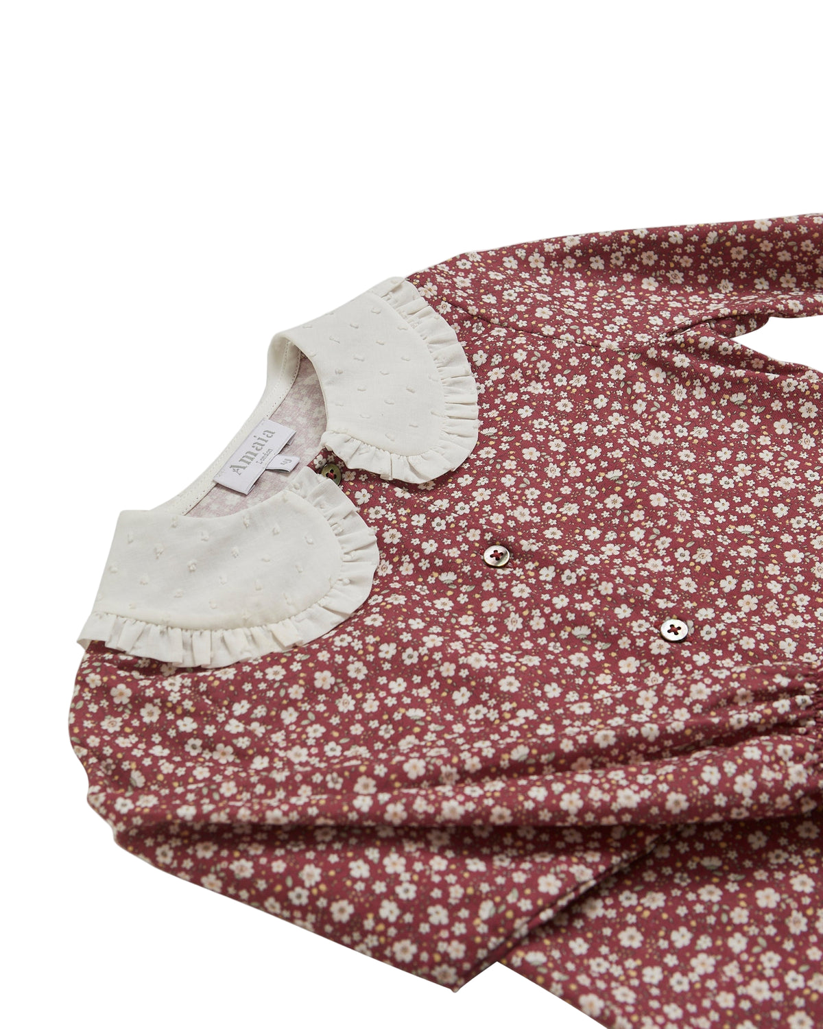 Floral dress with white collar on a white background