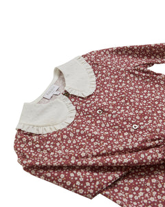 Floral dress with white collar on a white background