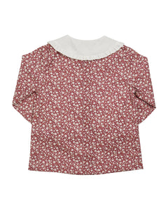 Floral blouse with a white collar on a white background