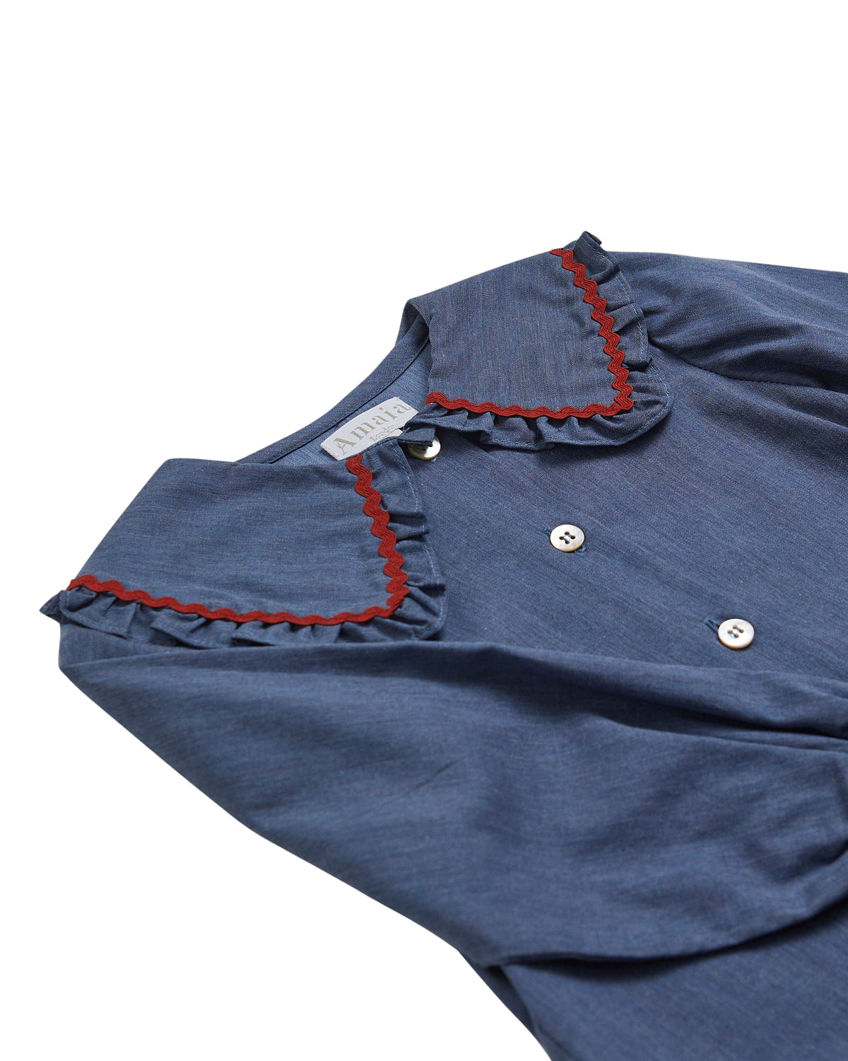 Blue dress with red trim on a white background