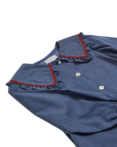 Blue dress with red trim on a white background