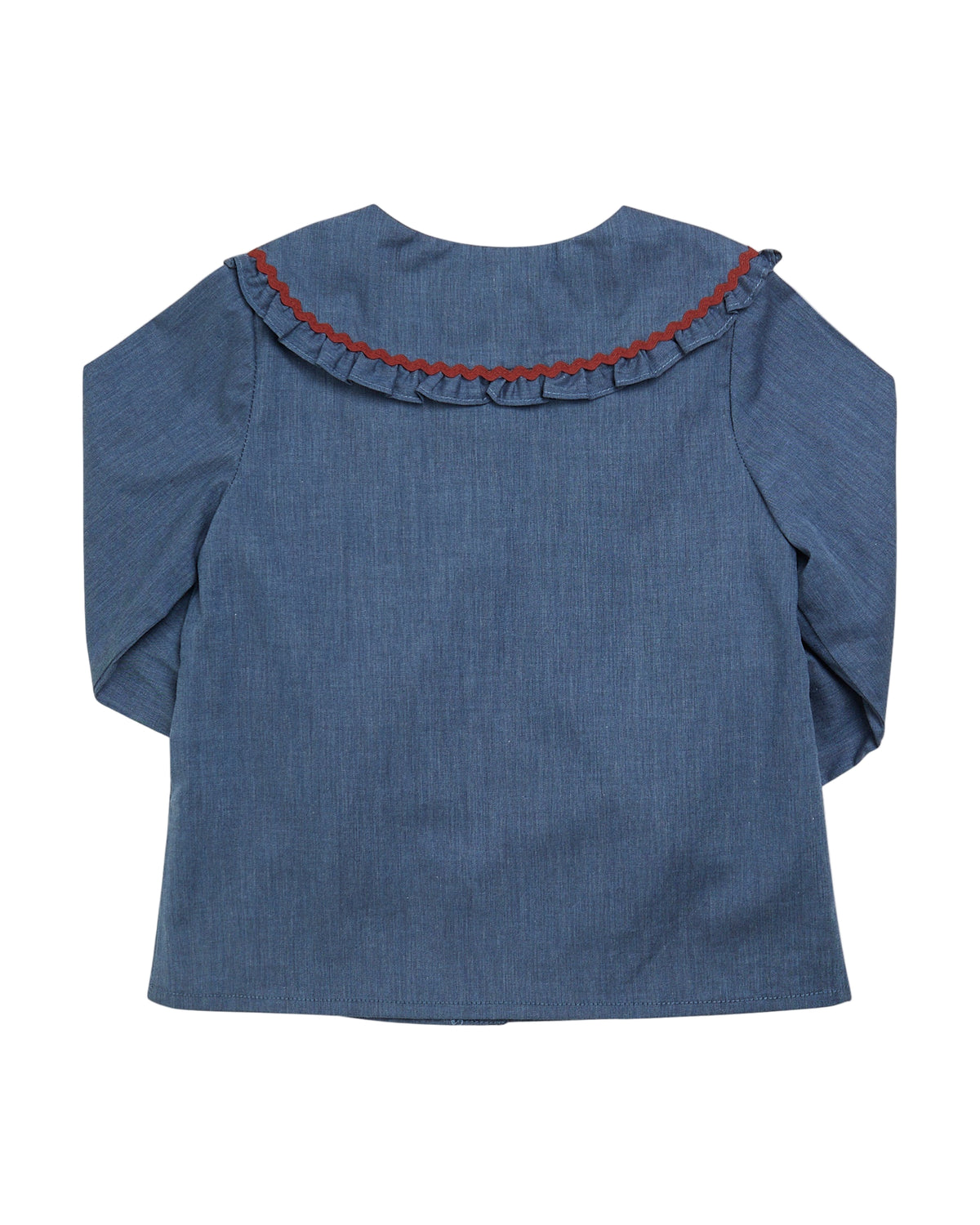 Blue denim blouse with red trim on a white background