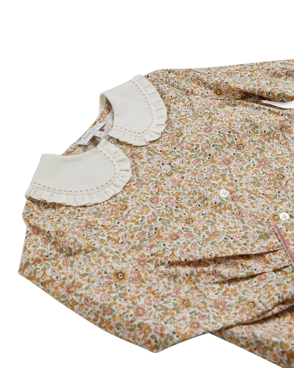 Floral dress with a white collar on a white background