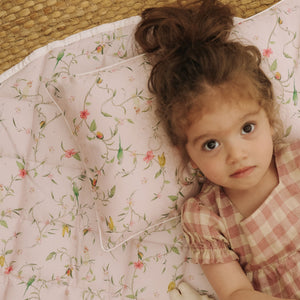 Dreaming of Paradise Toddler Pillow  with little girl laying cozy in bed