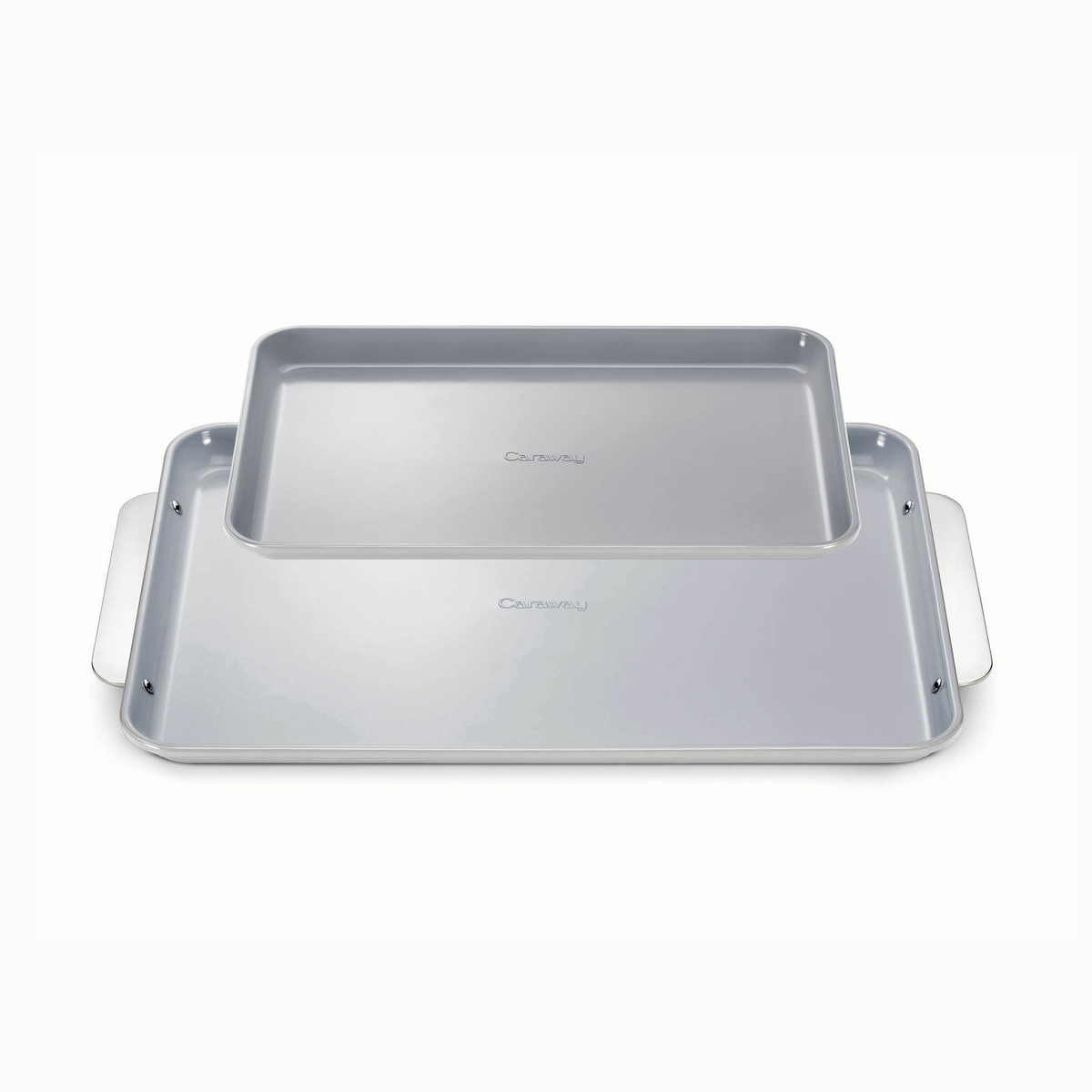Top-down view of Baking Sheet Duo: two stacked gray baking sheets, one large rimmed pan with side handles on white background