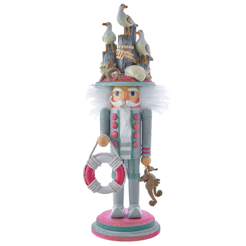 Front view of Hollywood Seagull Coastal Nutcracker showcasing a seagull hat, life preserver, and glittered seahorse