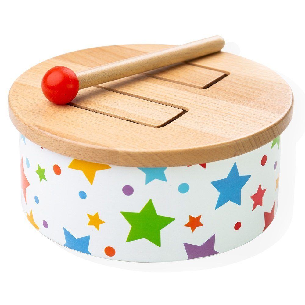 Angled view of wooden drum showcasing star print, cut-out top, and mallet on a white background