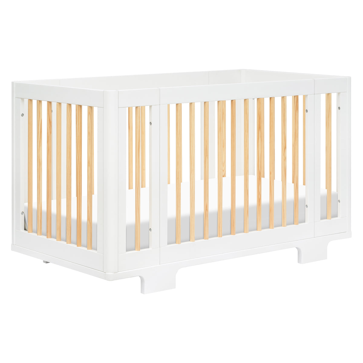 Front three-quarter view of Yuzu 8-in-1 convertible crib showcasing white frame and natural spindles on white background