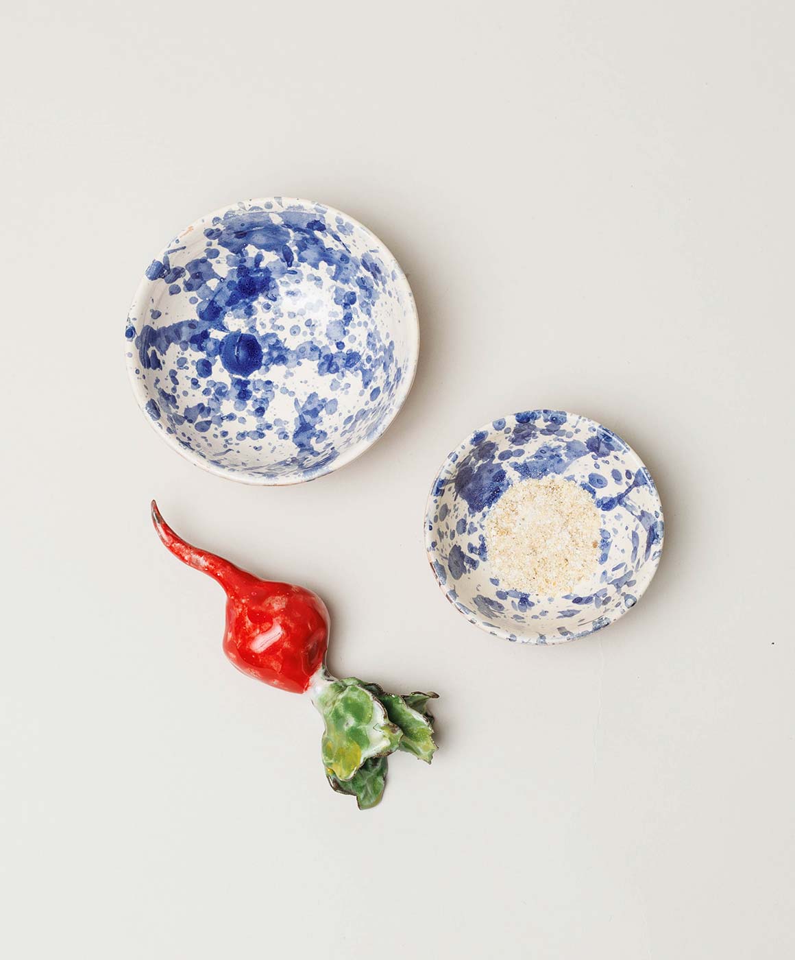 Top view of Montegranaro Blue & White Splatterware Oil & Salt Dish Set showcasing splatterware finish on light background