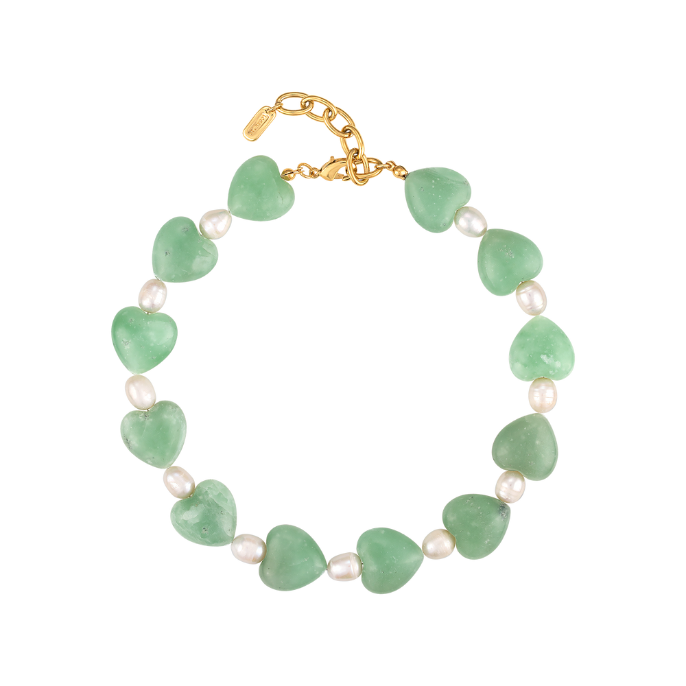 Top-down view of Aqua Heart Stone Necklace showcasing aqua heart-shaped stones and freshwater pearls with gold-toned extender on a plain background