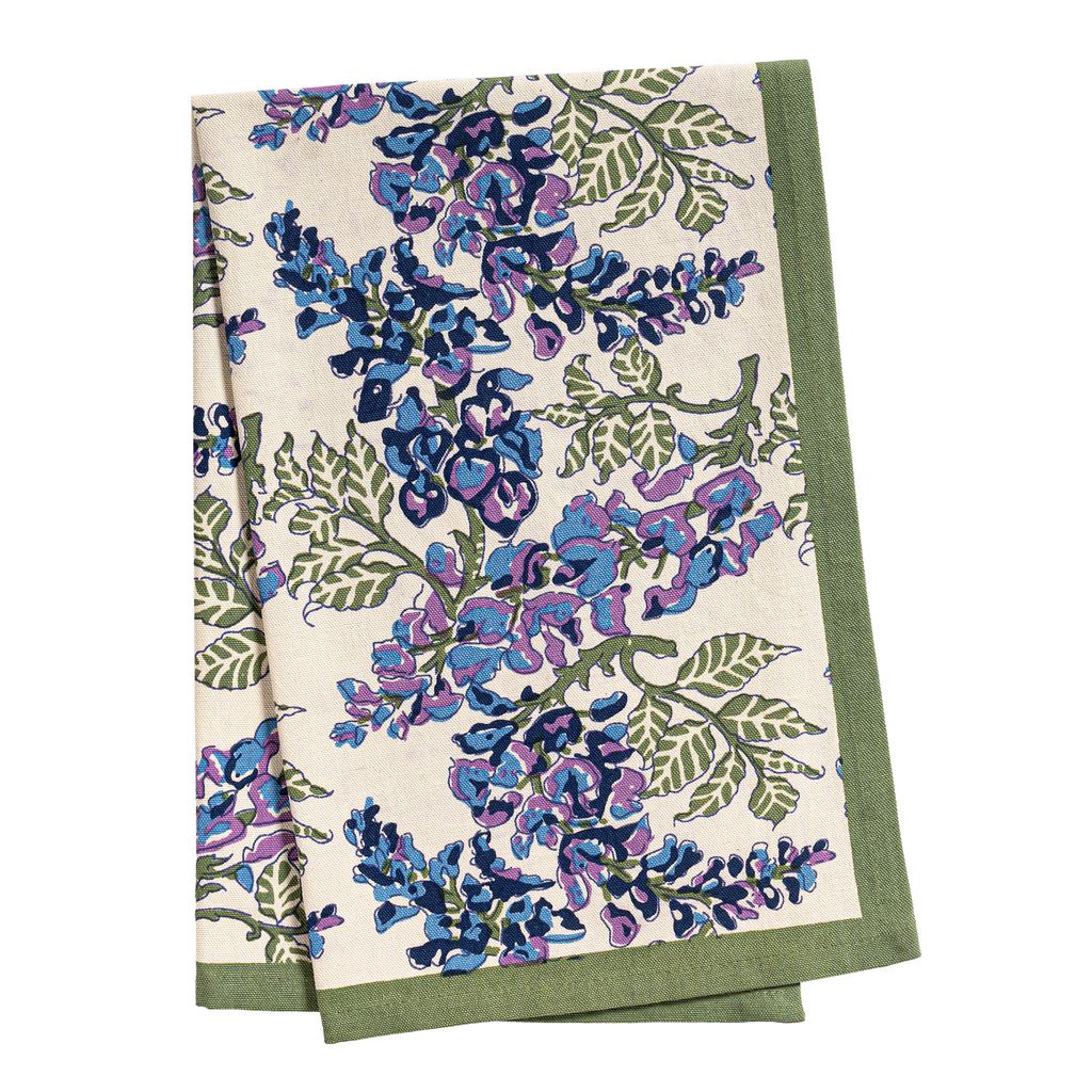 Folded view of Wisteria Tea Towels in Blue & Green, Set of 3 showcasing blue-purple flowers and olive vines on ivory