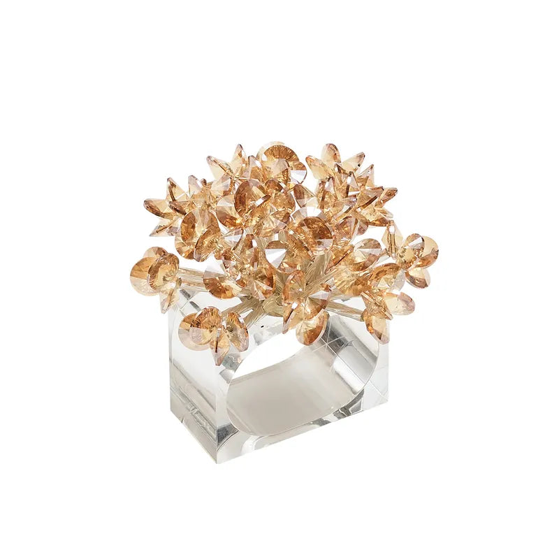 Angled view of Aster Napkin Ring in Champagne, set of 4 with red-colored glass beads on a square lucite ring