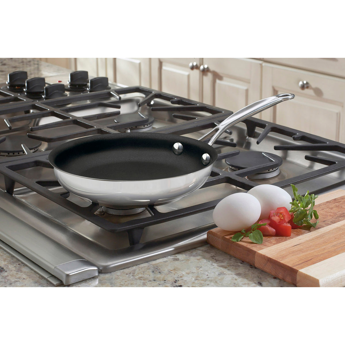 Angled view of Chef’s Classic 8-inch skillet showcasing polished stainless steel body and nonstick interior on a gas stovetop