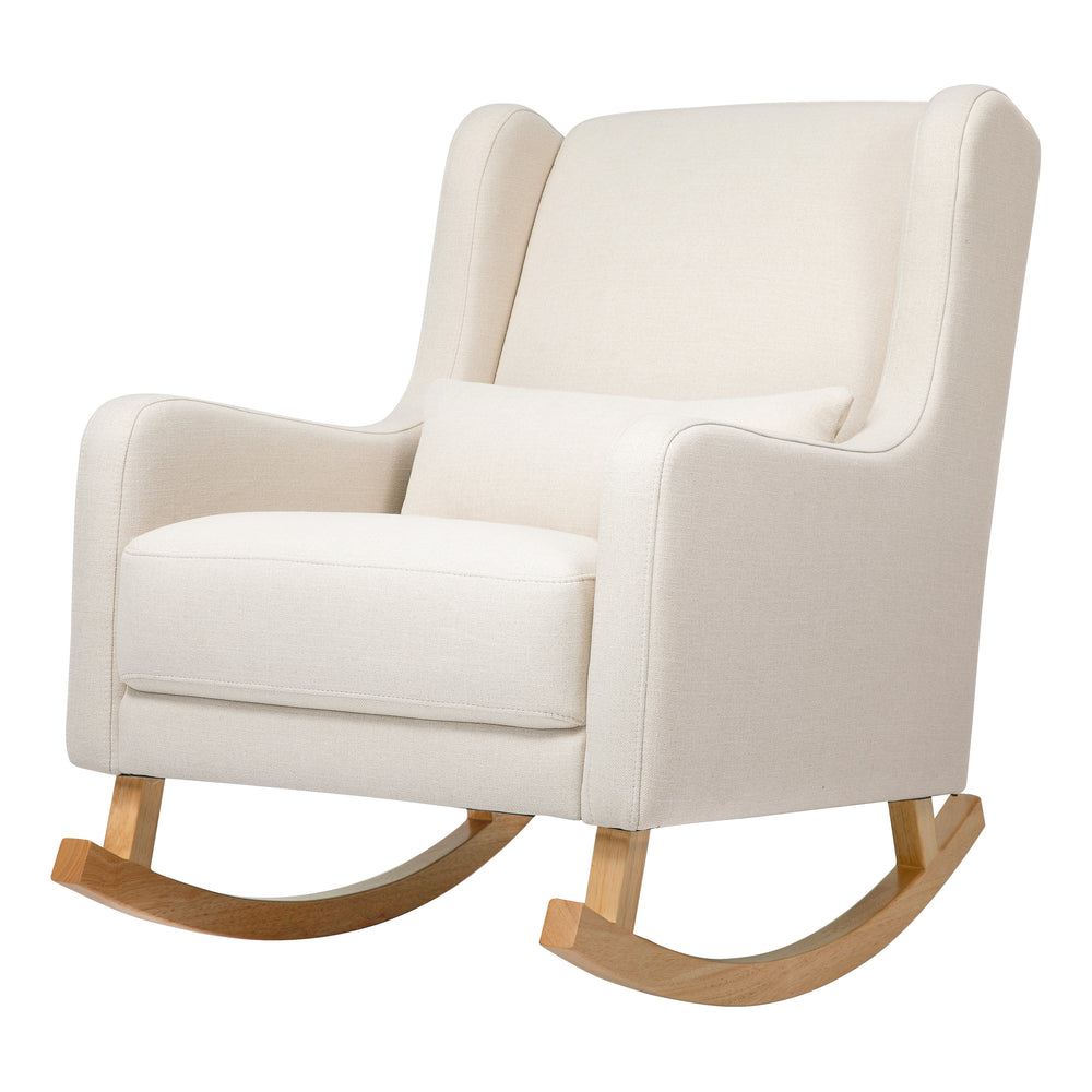 Three-quarter view of Kai Rocker rocking chair showcasing cream eco-performance fabric upholstery and natural wood rockers on white background