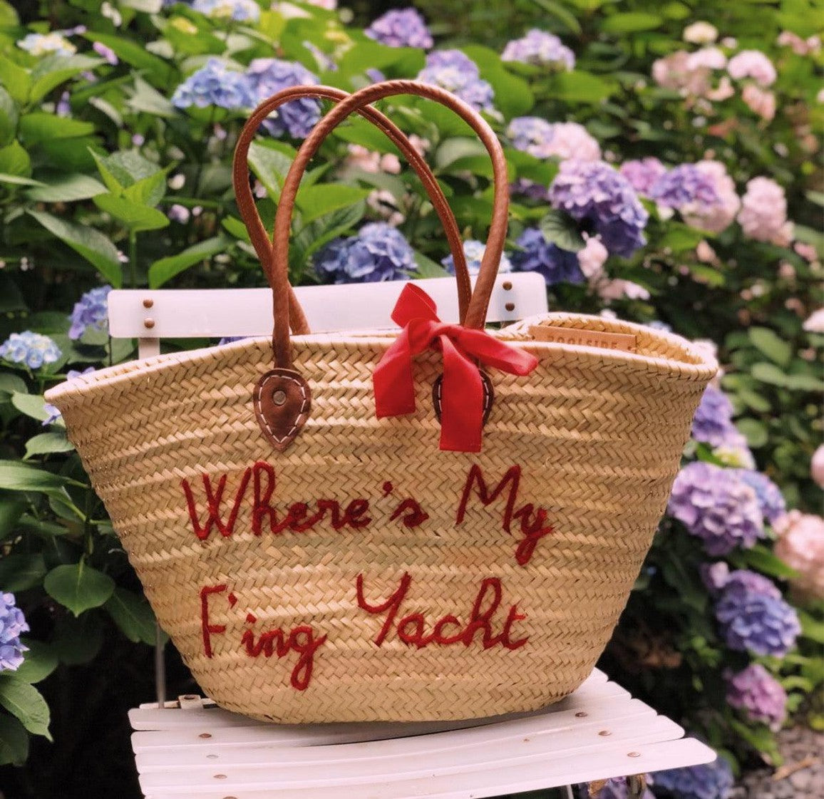 Long handle detail on customizable straw beach tote
