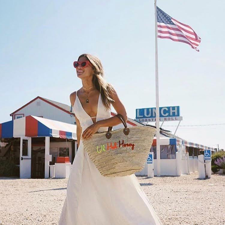 Large straw beach tote with short handles - customized straw beach tote bag - carried by Rocky Barnes in The Hamptons