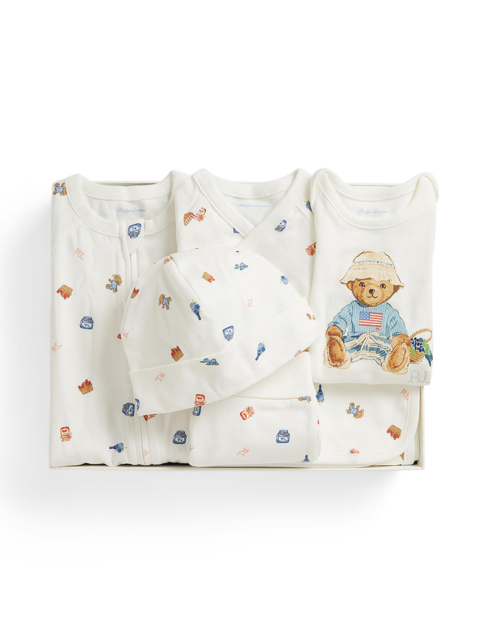 Top view of Berry Bear 6-piece baby gift set showcasing folded cotton garments, hat, and blanket with embroidered bear motif