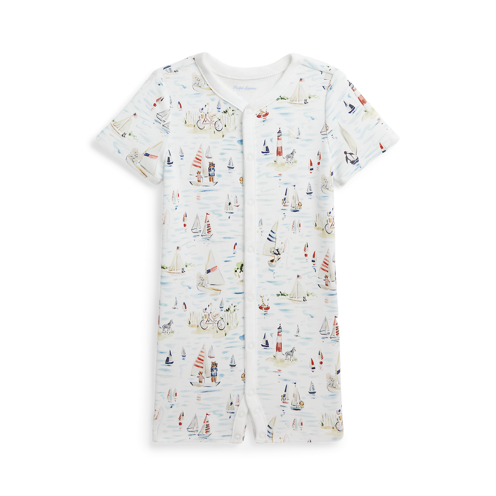 Front view of RL Baby x Riley Sheehey cotton shortall with short sleeves, snap-front placket, and nautical sailboat print