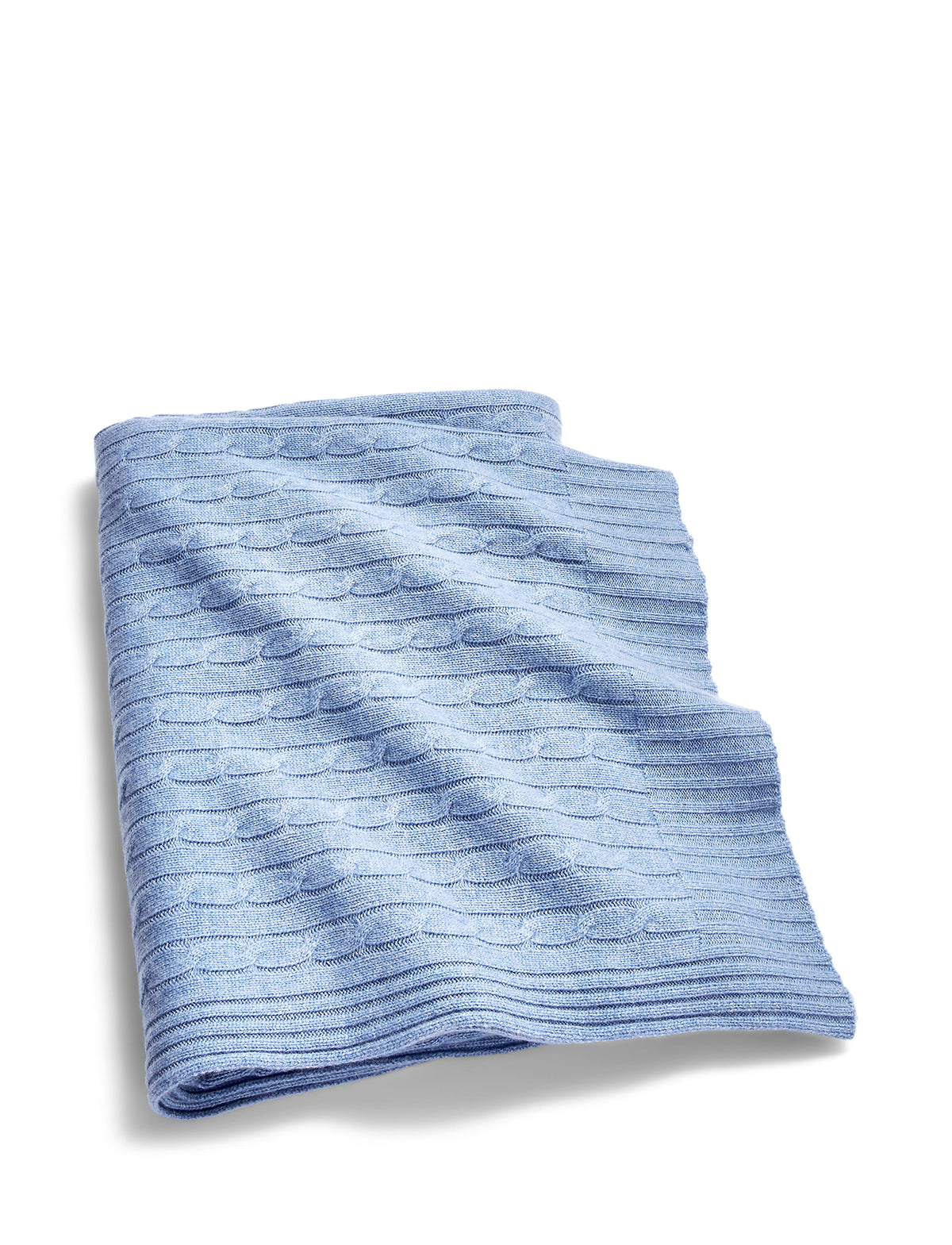 Folded view of Cable Cashmere throw blanket in heathered blue showcasing cable knit texture and ribbed edges on white background