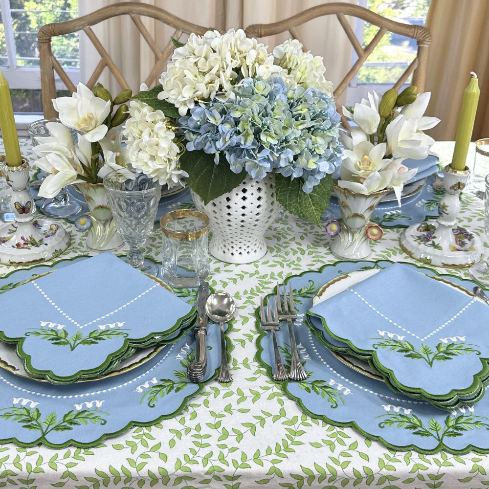 Lilly of the valley placemats and napkin on green leaves block print tablecloth