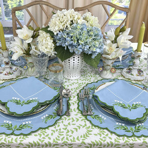 Lilly of the valley placemats and napkin on green leaves block print tablecloth