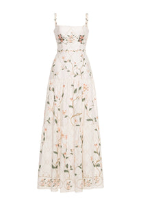 Front view of Lima Navegante Maxi Dress with floral print, square neckline, embroidered straps, and tiered ruffle skirt