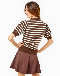 Model is wearing the Locust Active Sweater in Chocolate/ Off White Stripe with the Flounce Skort in Chocolate