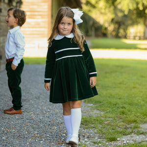Baby girls’ Long Sleeve Grace Bubble in Grafton Green Velvet with a white pleated collar, waist and cuff trim.
