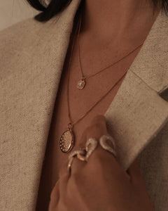 Etoile Locket Necklace shown with the Princess Necklace, Love Lock Ring, and Medusa Ring, 14k yellow gold