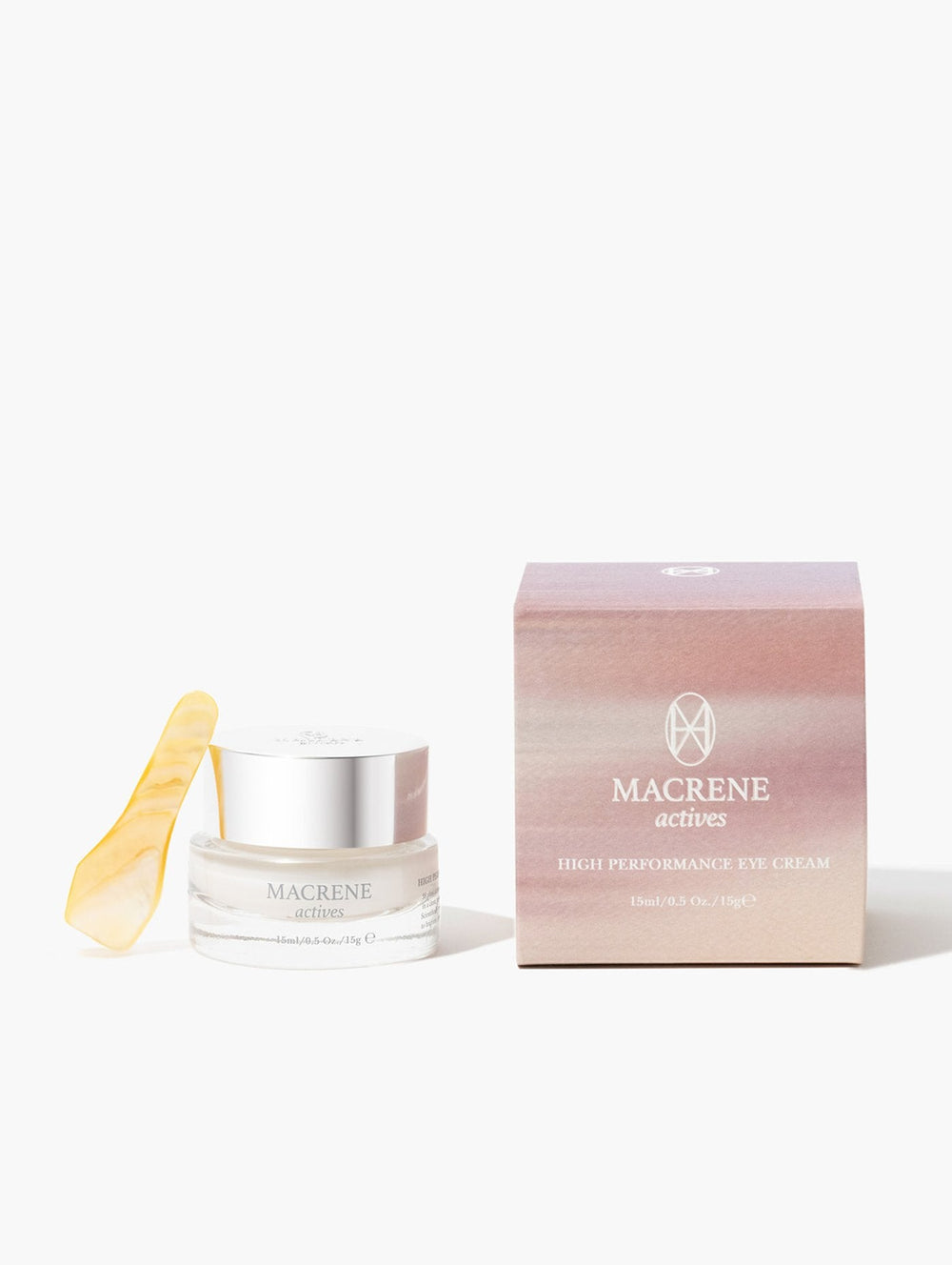 Front view of Macrene Actives High Performance Eye Cream jar and box with gold spatula on white background showcasing packaging