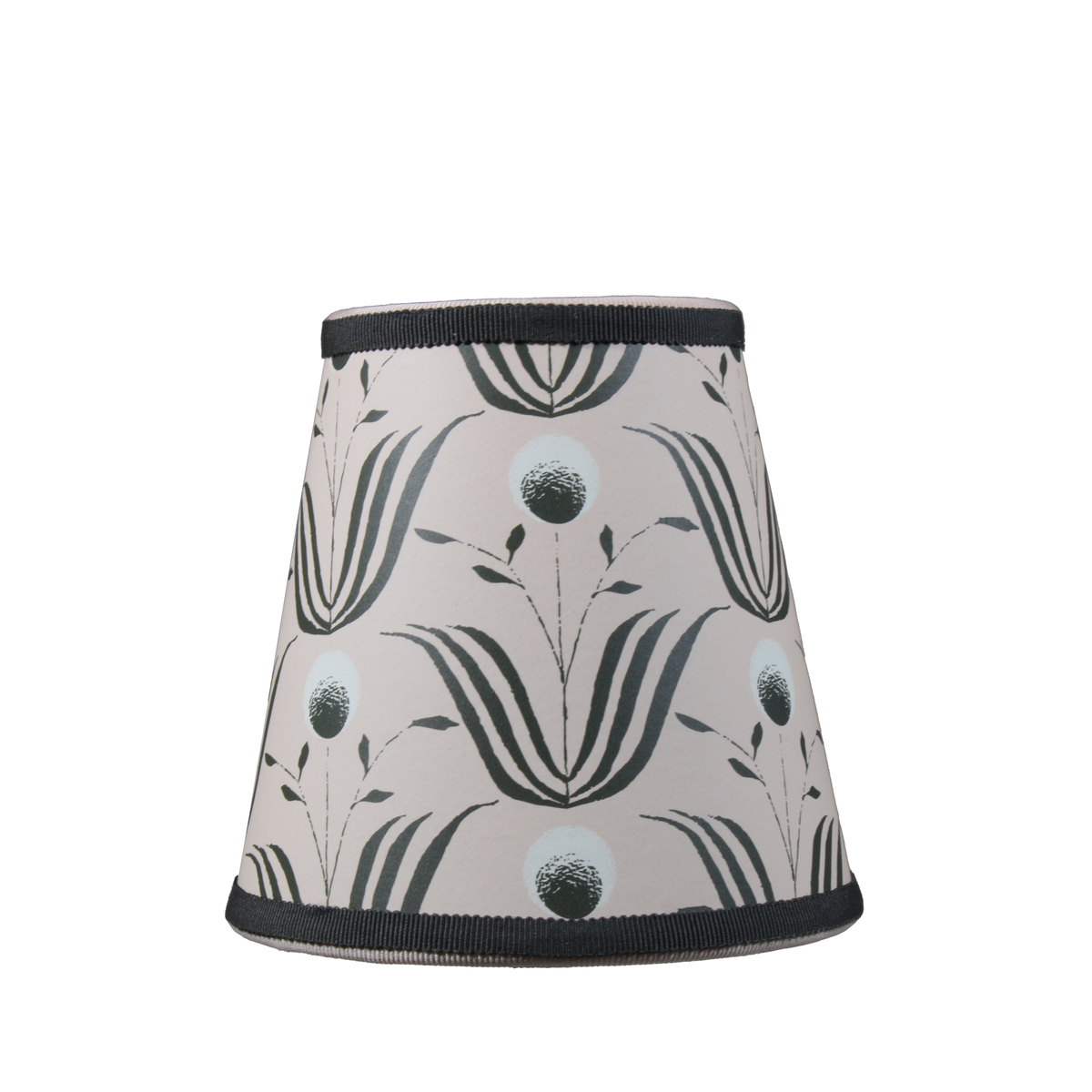 Front view of Mitchell Black Spring Bloom lampshade in blush ivory showing floral pattern and black trim on white background