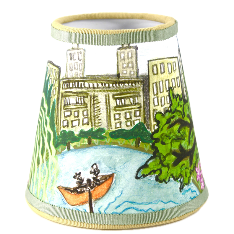 Front view of Central Park Parc series lampshade showing hand drawn skyline, pond and boat illustration with green ribbon trim