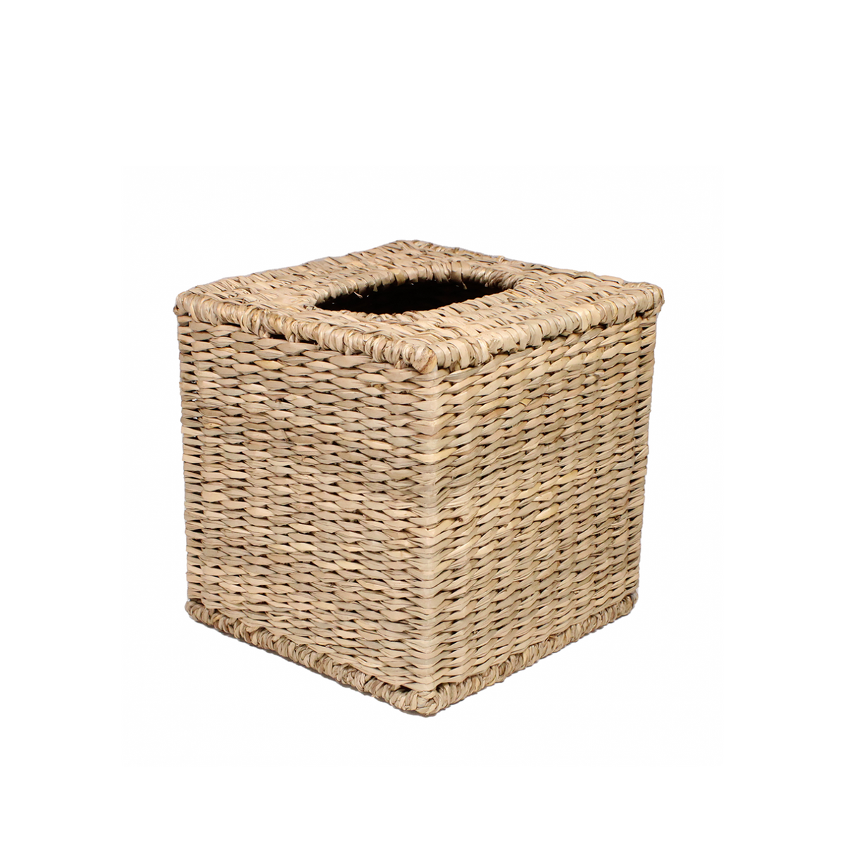 Three-quarter view of Tissue Cube cover showcasing handwoven seagrass weave and square top opening on white background