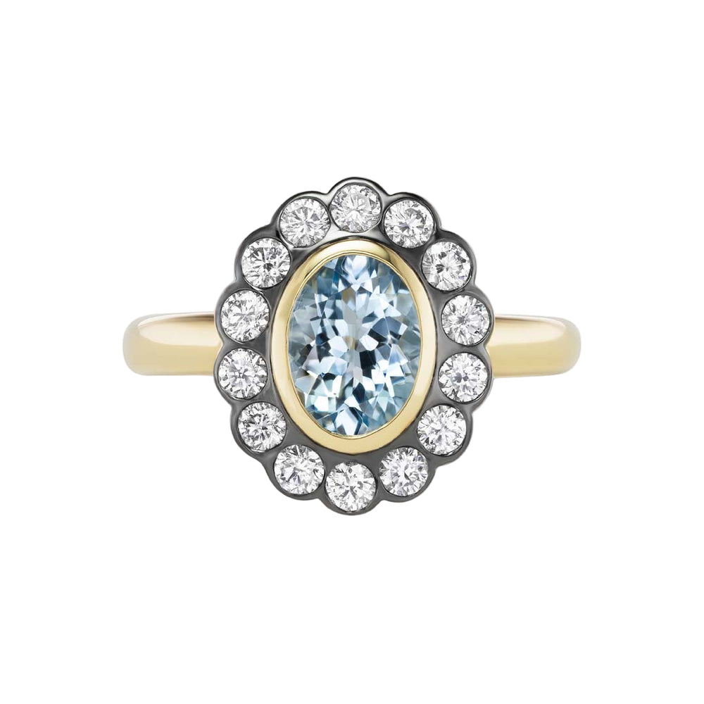 Front view of Lexie N/S ring showing north-south oval aquamarine with a halo of round diamonds on a white background