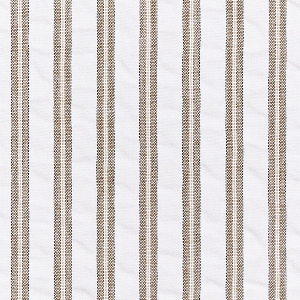 Matteo Coverlet in Bark styled on a bed