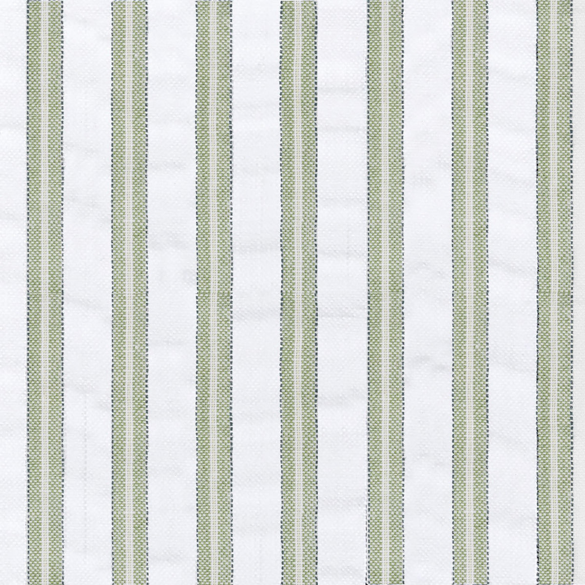 Matteo Quilt in Palm styled on a bed