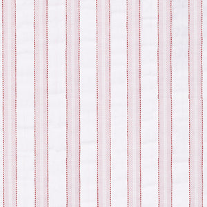 Matteo Quilt in Pink styled on a bed