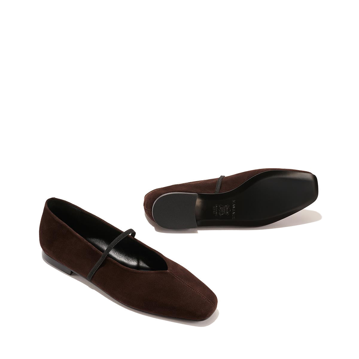 The Phoebe - Espresso Suede by margaux-development: a pair of dark brown suede ballet flats with sacchetto construction and a thin top strap, displayed on a plain light background—one upright, the other on its side.