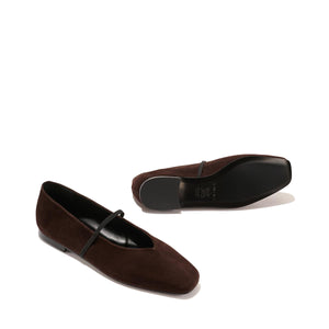 The Phoebe - Espresso Suede by margaux-development: a pair of dark brown suede ballet flats with sacchetto construction and a thin top strap, displayed on a plain light background—one upright, the other on its side.