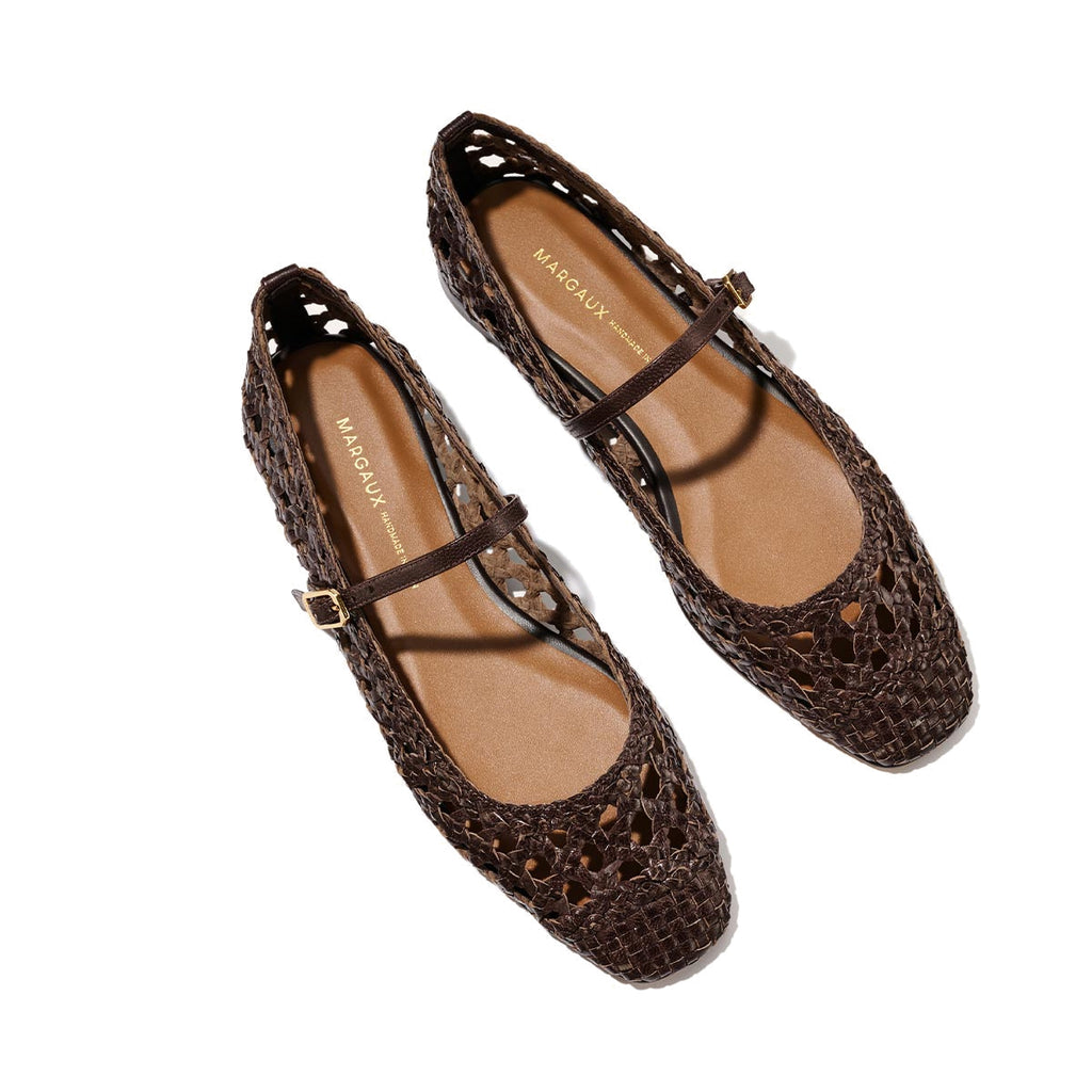 The Fonteyn Jane - Espresso Woven Leather by Margaux: brown handwoven leather flats with a closed toe, adjustable strap and gold buckle, shown on a light background. Tan insole branded with "Margaux.