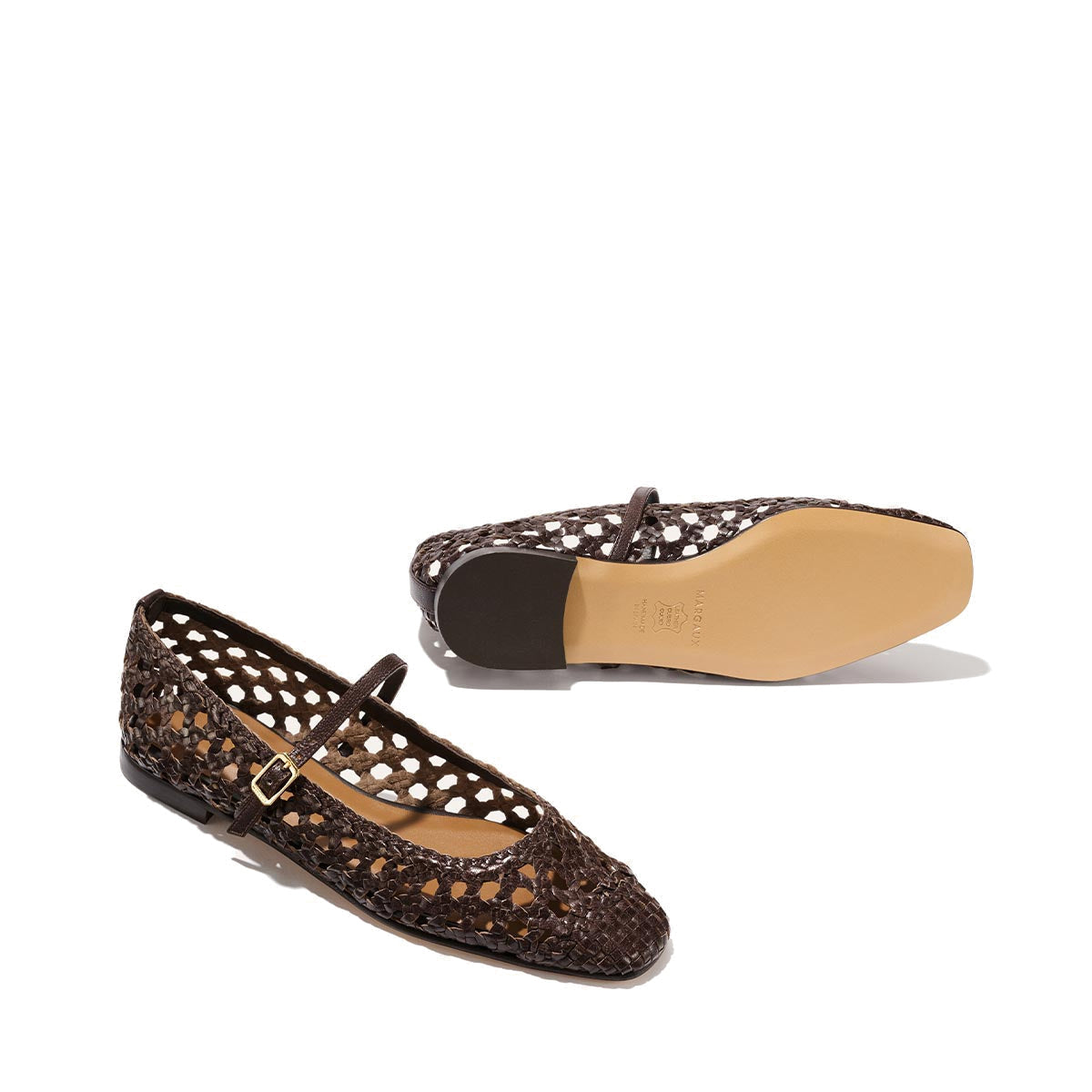 The Fonteyn Jane by Margaux: espresso handwoven leather flats with an adjustable buckle strap, open lattice design, and tan soles—one shoe upright, one on its side displaying the sole; elegant and comfortable ballerina style.
