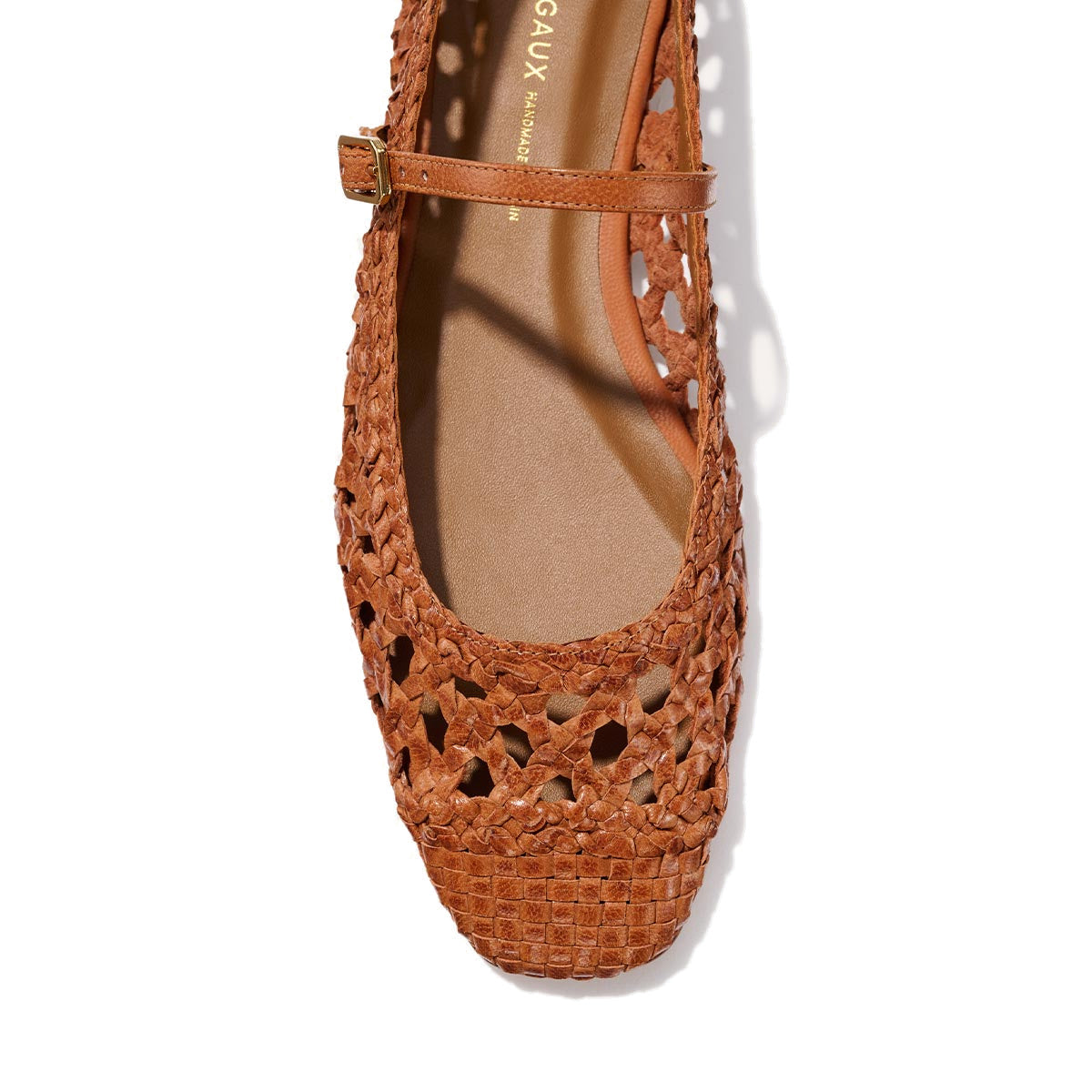 Top view of Margaux's The Fonteyn Jane - Saddle Woven Leather, a handwoven ballerina flat with a square toe, thin adjustable strap, side buckle, and intricate cutout patterns.