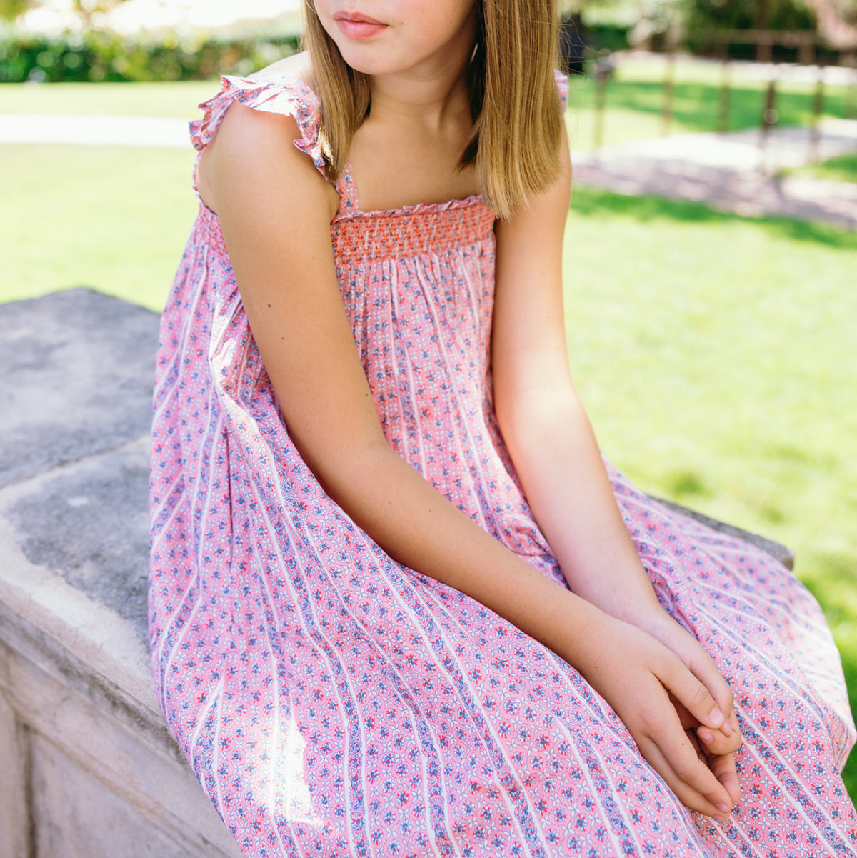 >The Girls’ Rosa Vine Smocked Dress with Flutter Sleeves